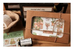Detail of pastoral illustration stickers in kraft packaging with twine for journaling