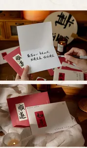 Detail of artistic Chinese greeting cards with hollow calligraphy and textured paper