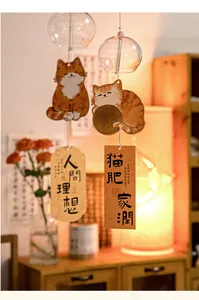 Japanese style glass wind chime with orange cat pendants and traditional blessings