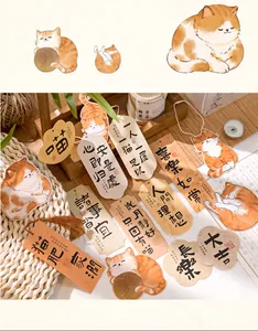Detail of cat-themed bookmarks with silk tassels and warm illustrations on cardstock