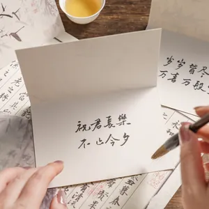 Traditional Chinese gold stamping greeting card with elegant black ink calligraphy