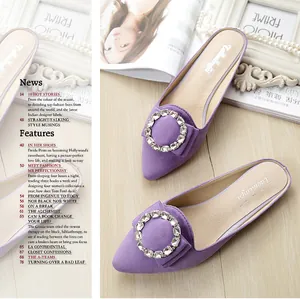 Detail of purple pointed-toe mule shoes with rhinestone buckle in an elegant lifestyle setting