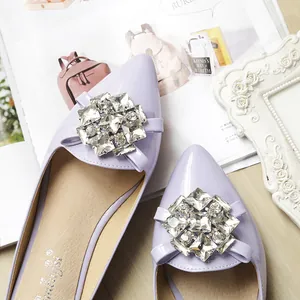 Detailed top view of lavender pointed flat shoe with a luxury sparkling crystal buckle