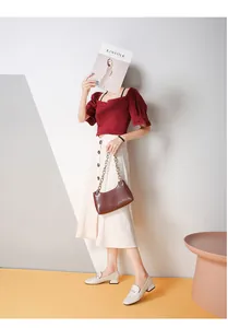Chic beige loafers styled with a square-neck top and buttoned A-line skirt