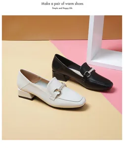 Chic block heel loafers featuring metal buckles and pearl accents in black and beige