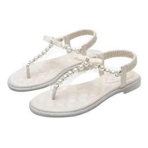 Elegant pearl T-strap flat sandals with rhinestone silk bows and quilted insoles
