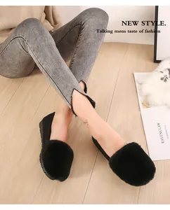Detail of fluffy black rabbit fur loafers for women with anti-slip rubber soles for winter