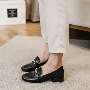 Classic black square-toe leather loafers with chunky heels and silver chain buckle decor