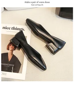 Minimalist black matte leather pointed toe pumps with side cutout and low block heels