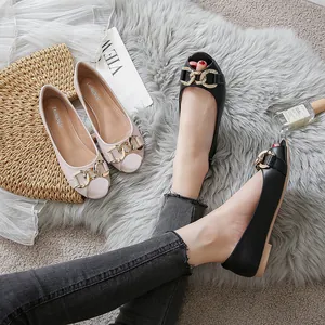 Chic women's flat loafers with bold gold chain links in black and cream beige