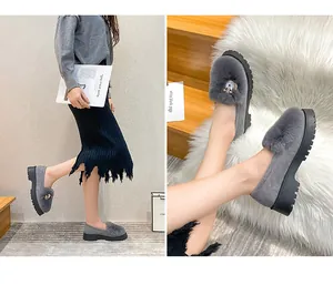 Detail showing plush grey loafer with metal buckle and thick anti-slip platform sole