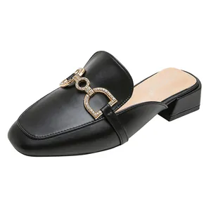 Elegant black square-toe mule with rhinestone horsebit detail and low block heel