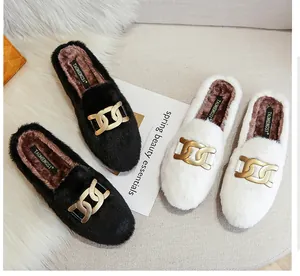 Faux fur mule slippers with gold chain detail in black and white colors