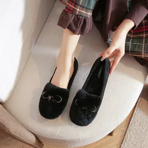 Plush faux rabbit fur flats with gold beaded bow detail and soft comfortable soles