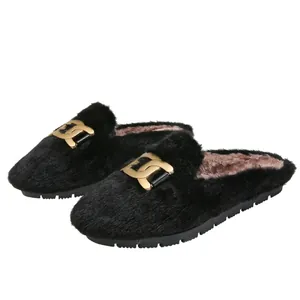 Women's black faux fur mule shoes with gold chain buckle and thick rubber soles