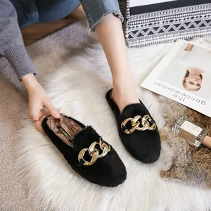 Chic black plush mules for women with a large gold chain buckle and warm fleece lining