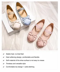 Detail showing silk satin Mary Jane flats with bow tie and elastic strap in soft colors