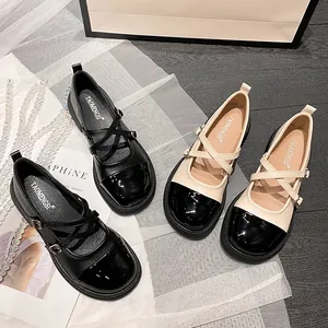 Chaussures Mary Jane rétro à bout rond avec brides croisées en noir et beige bicolore