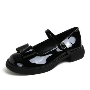 Classic black patent leather Mary Jane shoes with thick soles and bow detail