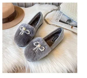 Flat gray plush loafers with pearl bow detail and warm faux fur lining for winter