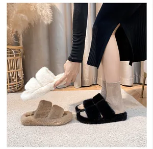 Close-up of warm faux fur slippers with plush double straps in white, brown and black colors