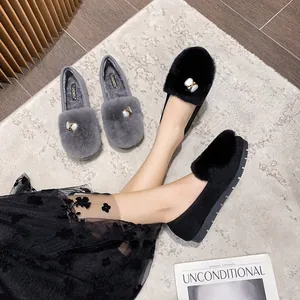 Women's warm fur-lined loafers in black and gray with golden buckles and thick soles
