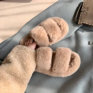 Fuzzy khaki double-strap slide sandals with thick soles for women in a lifestyle setting