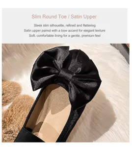 Détail de ballerines en soie noire avec grand nœud et design à bout rond élégant