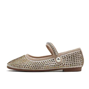 Sparkly girls Mary Jane flat shoes with rhinestones and pearl detail on a white background