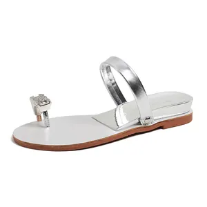 Silver rhinestone wedge toe-ring sandals with metallic finish and minimalist summer style