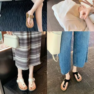 Women's platform thong sandals with adjustable metal buckles in brown, white and black
