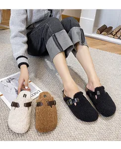Detailed view of warm sherpa buckled mule slippers in beige, brown and black colors
