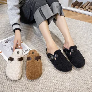 Fleece-lined Birkenstock style mule slippers with leather straps in white brown and black
