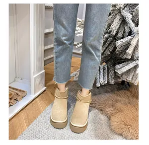 Detail of khaki suede platform snow boots with thick soles in a warm home setting