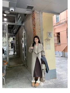 Street style view of women's warm brown platform shearling snow boots in winter
