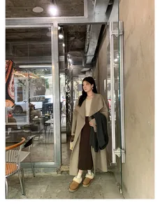 Outdoor street style view of camel platform fur slippers with beige wool coat