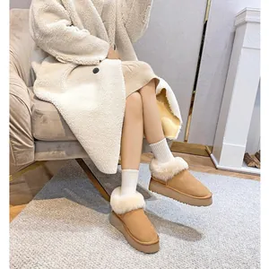 Women's camel sheepskin platform snow boots with plush faux fur collar and thick sole