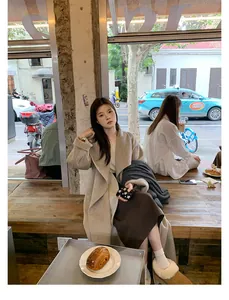 Chic autumn style featuring beige wool coat with khaki fur-lined winter loafers