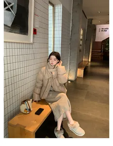 Chic beige short puffer jacket styled with wool skirt and plush winter slippers