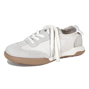 Vintage ballet-inspired leather sneakers with beige suede panels and gum rubber soles