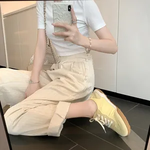 Women's light yellow leather sneakers with gum sole and minimalist casual style