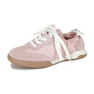 Women's pink suede casual sports shoes with breathable fabric and a non-slip rubber sole