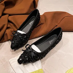 Elegant black pointed toe flats with sequins and a leather bow for women's spring fashion