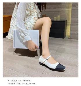Graceful figure in retro square toe Mary Janes with black and white two-tone leather