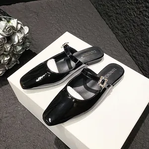 Elegant black patent leather square toe mule shoes with sparkling crystal buckle detail