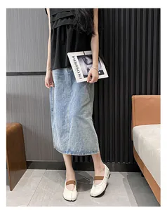 Chic light blue washed denim straight midi skirt paired with white split-toe flats