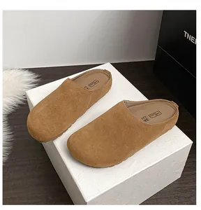 Top view of brown suede mule flats with soft footbed and round toe design