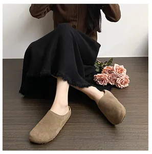 Minimalist brown suede platform mules worn by model for a vintage aesthetic look