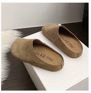 Detailed view of khaki suede mule showing high-quality texture and branded inner sole