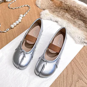 Silver metallic tabi flat shoes for women with bow detail and elastic strap